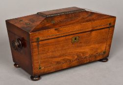 A Regency brass inlaid mahogany tea caddy Of sarcophagus form,