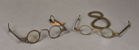 A pair of 18th century steel spectacles With applied printed paper label inscribed Early Steel