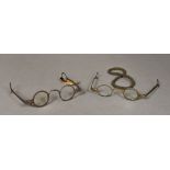 A pair of 18th century steel spectacles With applied printed paper label inscribed Early Steel