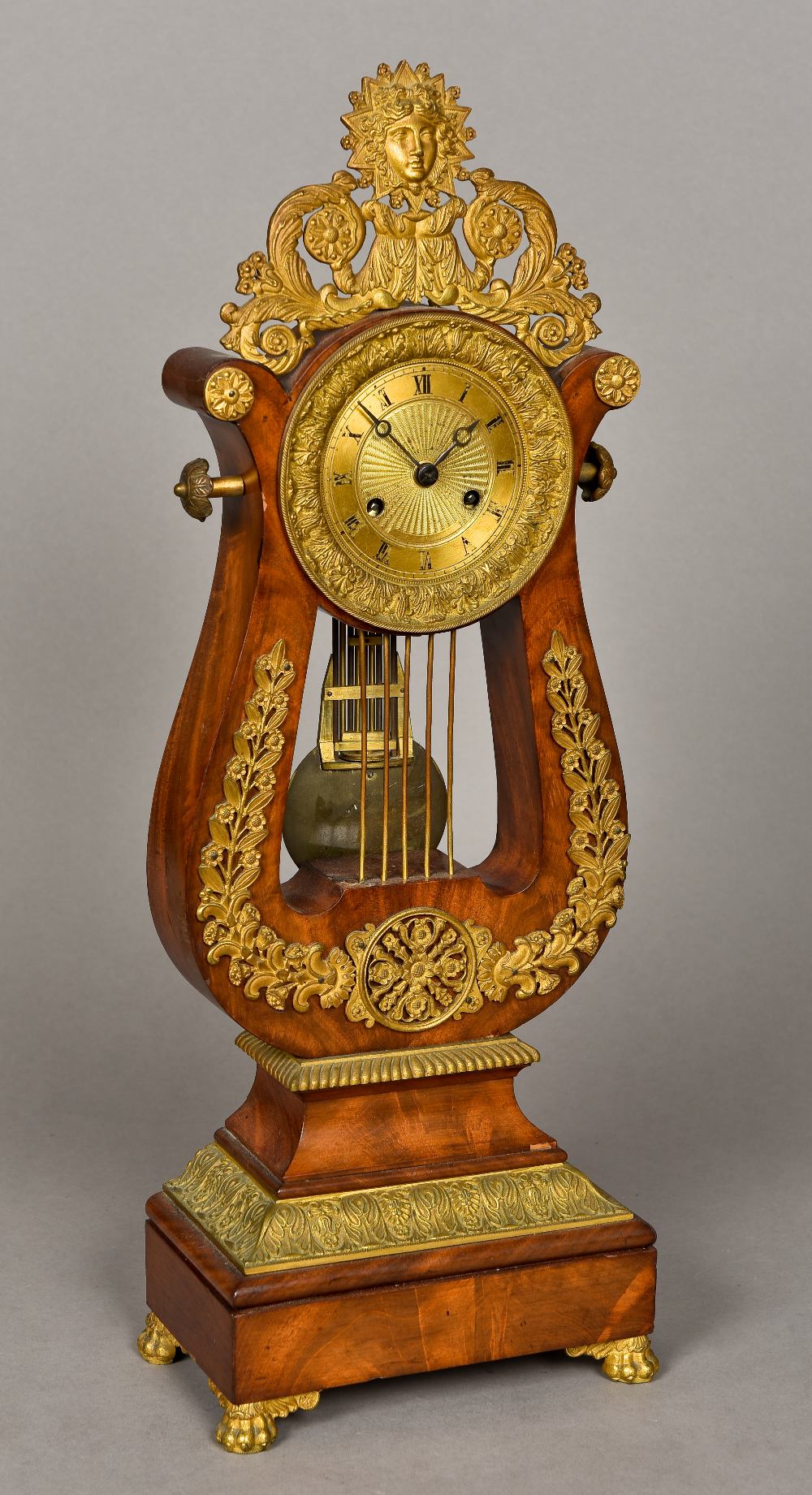 A 19th century French gilt bronze mounted mantel clock Of lyre form,