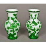 A pair of Chinese Peking glass vases Green flashed on a white ground, decorated with floral sprays.