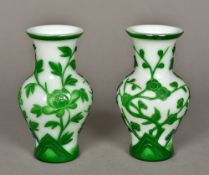 A pair of Chinese Peking glass vases Green flashed on a white ground, decorated with floral sprays.
