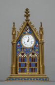 An enamel decorated gilt bronze, probably Russian, desk clock Of Gothic Revival architectural form,