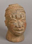 An African terracotta model of a male bust Together with an African tribal carved wooden model of a