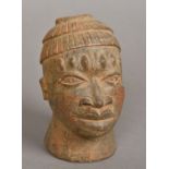 An African terracotta model of a male bust Together with an African tribal carved wooden model of a