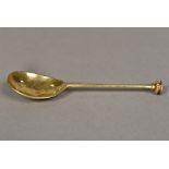 A silver gilt seal top spoon, marks indistinct The finial crested. 15.5 cm long.