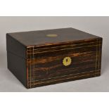 A 19th century brass inlaid coromandel writing box Enclosing a typically fitted interior.