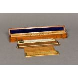 A Victorian ivory backed thermometer Together with a collection of various ivory and boxwood rules,