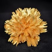 An 18 ct gold brooch Of floral spray form, the reverse marked 18K. 4.5 cm wide.