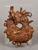 A Black Forest carved wooden wall pocket Carved as a bird's nest. 15 cm high.