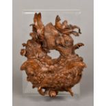 A Black Forest carved wooden wall pocket Carved as a bird's nest. 15 cm high.