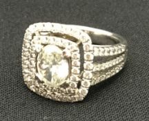 A white gold and diamond ring The central stone approximately 1.
