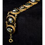 A pietre dura bracelet Set with six specimen stone floral roundels. 15 cm long.