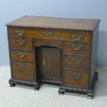 An 19th century yewwood kneehole desk The carved rectangular top above an arrangement of eight