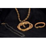 Four pieces of Victorian unmarked yellow metal mounted hair plait mourning jewellery Comprising: a