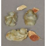 Three Chinese jade carvings Each of figural form, each with applied wax sealed paper label.