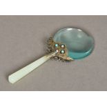 A Chinese white metal and jade mounted turquoise set magnifying glass 18.5 cm long.