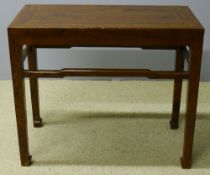 A 19th century Chinese elm table The panelled rectangular top above the tapering square section