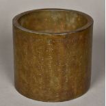 A Chinese bronze brush pot Extensively worked with calligraphic script. 15.5 cm high.