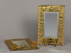 A pair of Arts & Crafts brass framed twin branch girandoles Each embossed with fruiting swags.