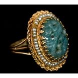 An unmarked gold, jade and seed pearl ring Of domed form,