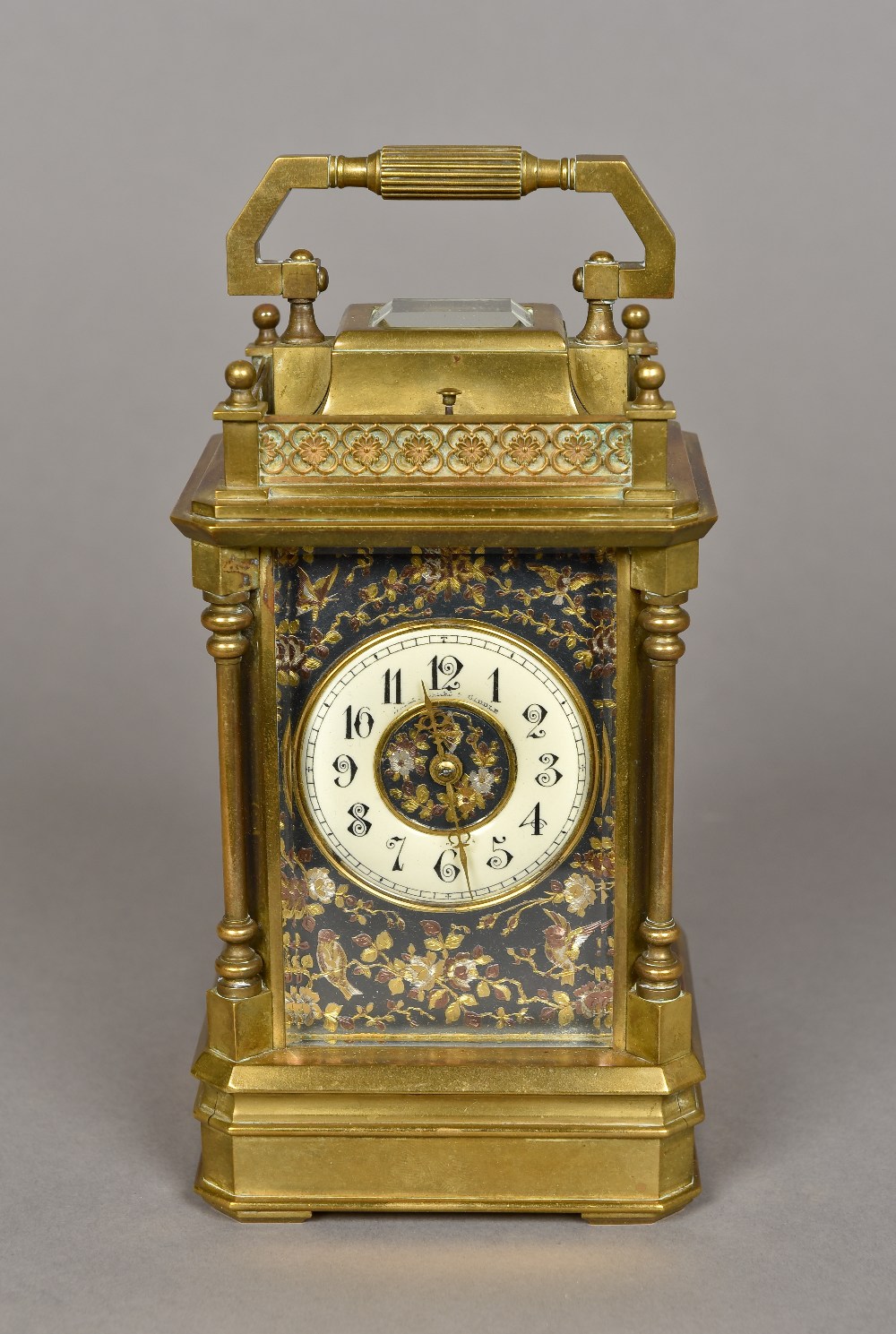 A bronze cased repeating carriage clock retailed by Bailey Banks & Biddle The signed dial with