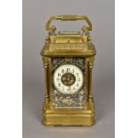 A bronze cased repeating carriage clock retailed by Bailey Banks & Biddle The signed dial with