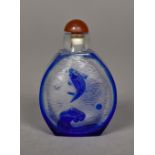 A Peking cameo glass snuff bottle Decorated to either side with a fish. 6.5 cm high.