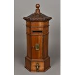 A Victorian style country house table top pillar box Of hexagonal form with brass fittings.