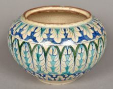 A near Eastern pottery vase Decorated in the Iznik palette with acanthus scrolls. 19.5 cm high.
