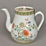 A Chinese Kuang-Hsu period porcelain teapot and cover Decorated in the famille rose palette,