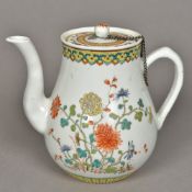 A Chinese Kuang-Hsu period porcelain teapot and cover Decorated in the famille rose palette,
