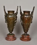 A pair of 19th century Art Nouveau patinated bronze vases Each of twin handled form,