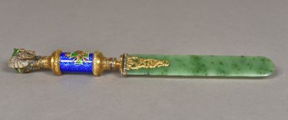 A Russian diamond inset and enamel decorated silver gilt and spinach jade page turner The handle