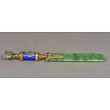 A Russian diamond inset and enamel decorated silver gilt and spinach jade page turner The handle