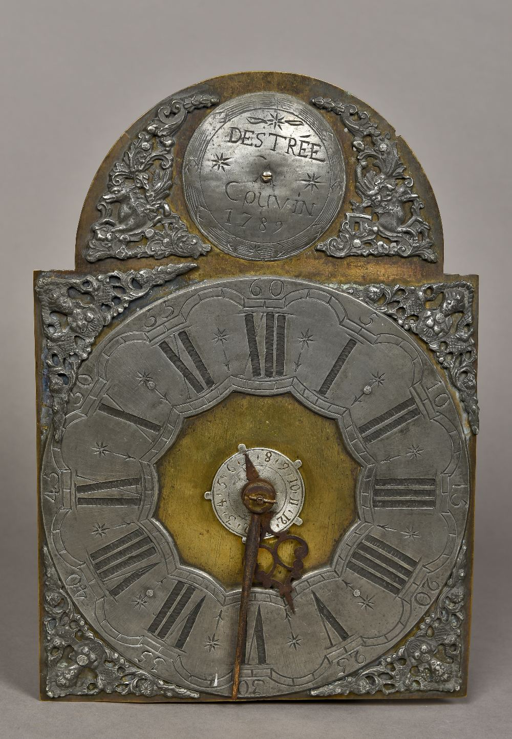 An 18th century style Dutch clock movement The arched brass face with silvered chapter ring with