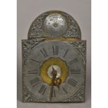 An 18th century style Dutch clock movement The arched brass face with silvered chapter ring with
