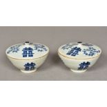 A pair of Chinese blue and white porcelain bowls and covers Each decorated with foliate scrolls