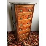 A 19th century French chest of drawers The loose grey variegated marble top above six brass mounted