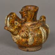 A Sawankhalok pottery vase Of squat bulbous form, issuing an elephant mask. 6.5 cm high.