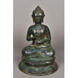 A patinated bronze model of Buddha Typically modelled seated in the lotus position. 34.5 cm high.