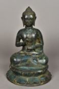 A patinated bronze model of Buddha Typically modelled seated in the lotus position. 34.5 cm high.