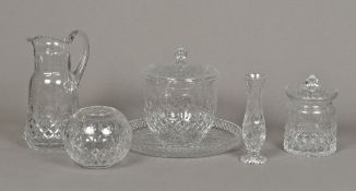 A group of cut lead crystal glass items Comprising: a jug, a biscuit barrel, a bonbon jar and cover,