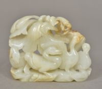 A Chinese carved white and russet jade group Worked with three geese. 8 cm wide.