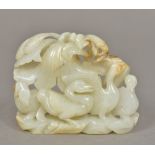 A Chinese carved white and russet jade group Worked with three geese. 8 cm wide.