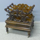 A Victorian rosewood Canterbury The pierced scroll carved and turned top section above a deep