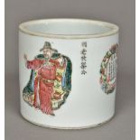 A 19th century Chinese porcelain brush pot Decorated in the round with courtly figures and