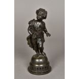 A 19th century patinated bronze model of a bacchic putto Modelled holding a bunch of grapes,