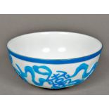 A Chinese Peking glass bowl Turquoise flashed on a white ground,