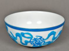 A Chinese Peking glass bowl Turquoise flashed on a white ground,
